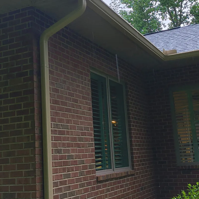 Seamless gutter and downspout on a red brick Middle Tennessee home